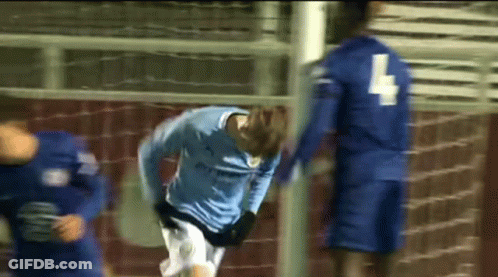 A Soccer Player In A Blue Jersey With The Number 4 On His Back GIF