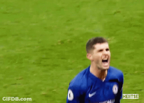 A Soccer Player In A Blue Shirt Is Screaming On The Field GIF