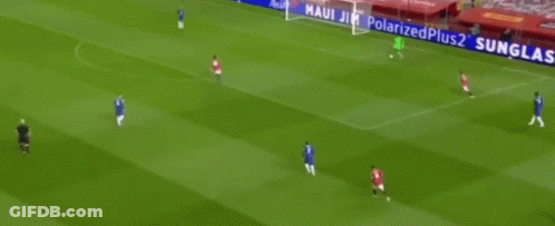 A Soccer Player In A Green Jersey Is Standing In Front Of A Net . GIF