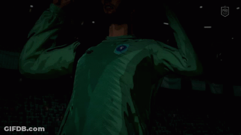 A Soccer Player In A Green Jersey With A Blue Circle On The Front GIF