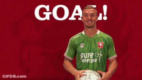 A Soccer Player In A Green Pure Energie Jersey Holds A Ball GIF