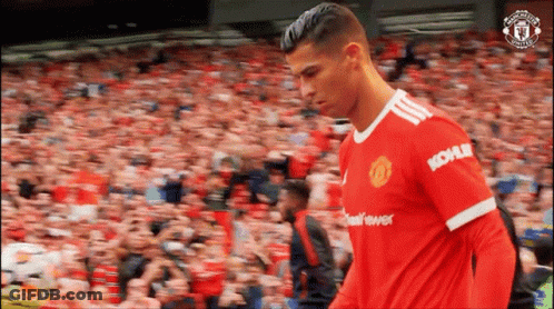 A Soccer Player In A Kohler Jersey Walks In Front Of A Crowd . GIF