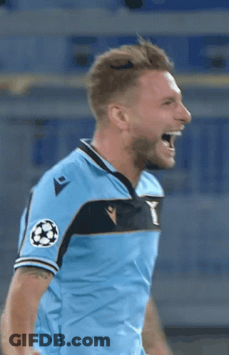 A Soccer Player In A Light Blue Shirt Is Screaming With His Mouth Open . GIF