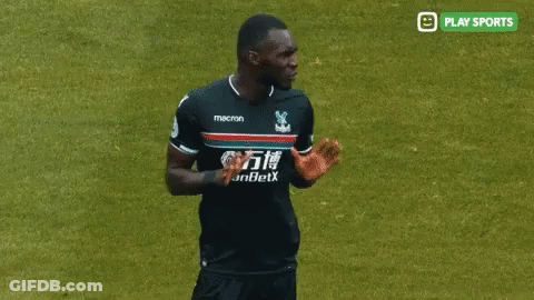 A Soccer Player In A Macron Jersey Talks To A Referee GIF