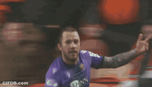 A Soccer Player In A Purple Jersey With The Number 23 On It GIF