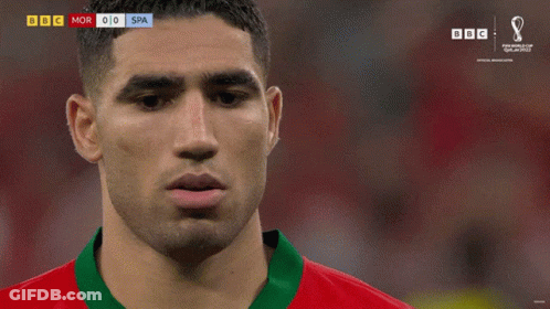 A Soccer Player In A Red And Green Jersey With The Number 2 On The Front GIF