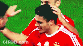 A Soccer Player In A Red And White Adidas Jersey GIF