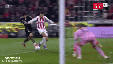 A Soccer Player In A Red And White Striped Jersey Is Kicking A Soccer Ball GIF