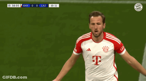A Soccer Player In A Red And White T-Mobile Jersey Is Running On The Field GIF