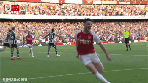 A Soccer Player In A Red Emirates Jersey Celebrates His Goal GIF