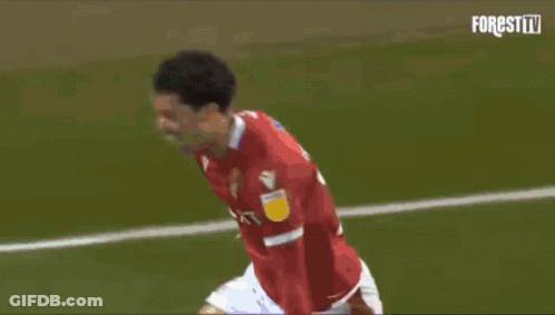 A Soccer Player In A Red Jersey Celebrates His Goal GIF