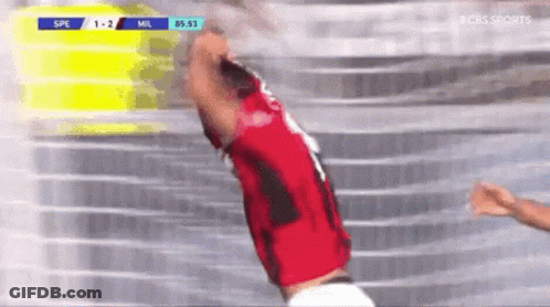A Soccer Player In A Red Jersey Is Jumping In The Air During A Game . GIF