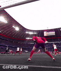 A Soccer Player In A Red Jersey Is Jumping In The Air To Catch A Ball GIF