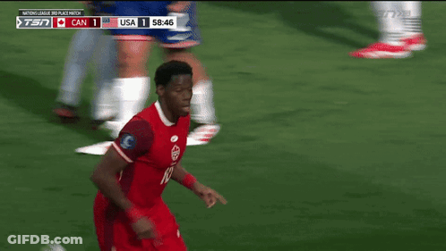 A Soccer Player In A Red Jersey Is Running On The Field GIF