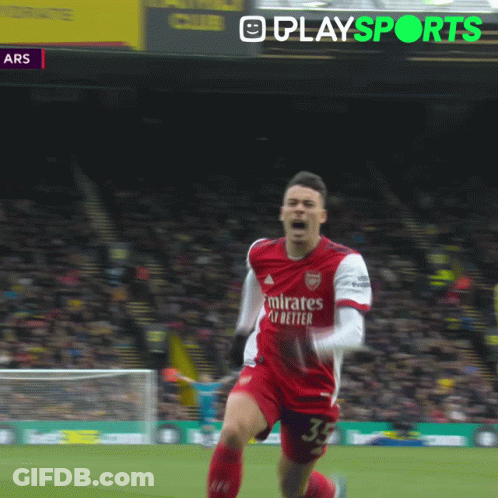 A Soccer Player In A Red Jersey With The Number 11 On His Shorts Is Running On The Field GIF