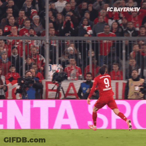 A Soccer Player In A Red Jersey With The Number 9 On It GIF