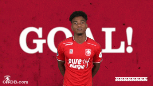 A Soccer Player In A Red Pure Energie Shirt Giving A Thumbs Up GIF