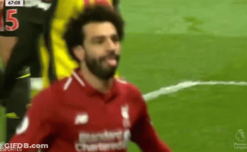 A Soccer Player In A Red Shirt With The Number 15 On His Jersey GIF