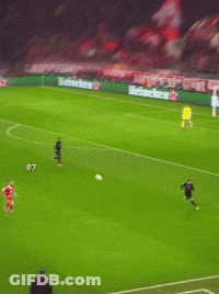 A Soccer Player In A Red T-Mobile Jersey Is Running Towards The Ball GIF
