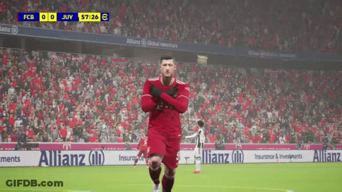 A Soccer Player In A Red Uniform Is Running On The Field GIF