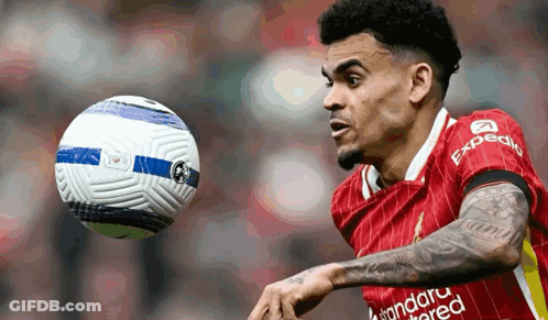 A Soccer Player In A Red Uniform With Expedia Written On His Jersey GIF