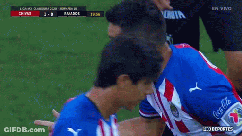 A Soccer Player In A Red White And Blue Uniform Is Being Congratulated GIF