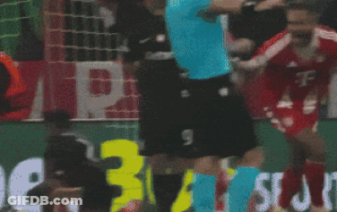 A Soccer Player In A T-Mobile Jersey Is Being Tackled GIF