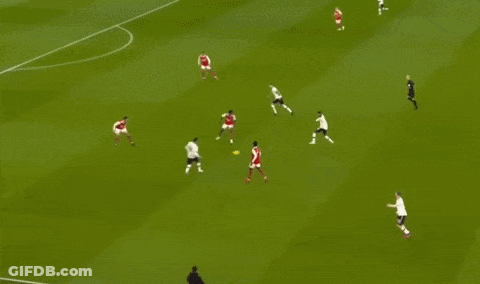 A Soccer Player In A White Shirt Is Running On The Field . GIF