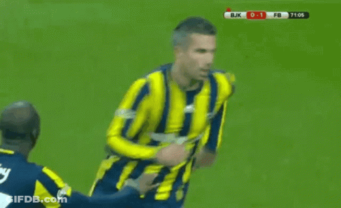 A Soccer Player In A Yellow And Blue Striped Shirt Is Being Tackled By Another Player On The Field . GIF