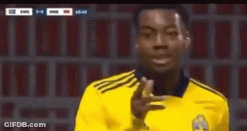 A Soccer Player In A Yellow Jersey Is Giving A Thumbs Up Sign . GIF
