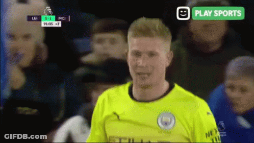 A Soccer Player In A Yellow Jersey Stands In Front Of A Play Sports Banner GIF