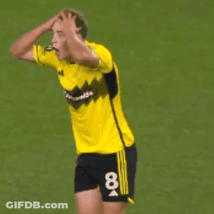 A Soccer Player In A Yellow Jersey With The Number 19 On The Back GIF