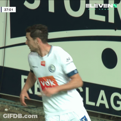 A Soccer Player In Front Of A Sign That Says " Eleven " GIF