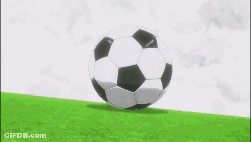 A Soccer Player In Red Shorts Is Kicking A Soccer Ball GIF