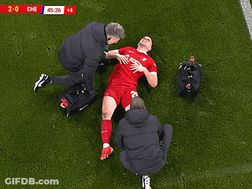 A Soccer Player Is Being Helped On The Field With The Score 2-0 Che GIF