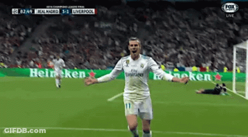 A Soccer Player Is Celebrating A Goal During A Game . GIF