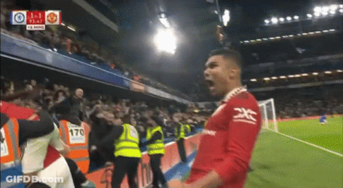 A Soccer Player Is Celebrating A Goal During A Match GIF