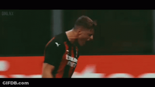 A Soccer Player Is Celebrating A Goal In Front Of A Fly Emirates Banner . GIF