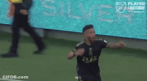 A Soccer Player Is Celebrating A Goal On A Field GIF