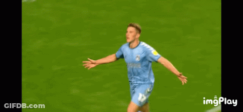 A Soccer Player Is Celebrating A Goal On The Field GIF