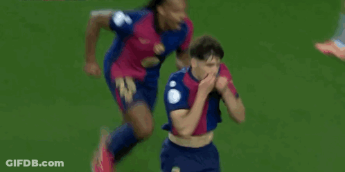A Soccer Player Is Celebrating A Goal On The Field While Another Player Watches . GIF