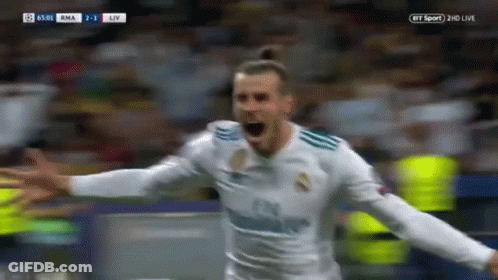 A Soccer Player Is Celebrating A Goal With His Arms Outstretched In Front Of A Crowd . GIF