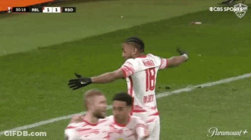 A Soccer Player Is Celebrating A Goal With His Teammates On A Soccer Field . GIF