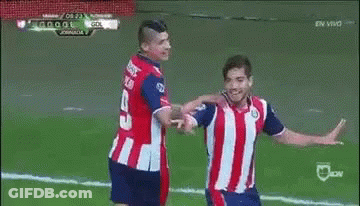 A Soccer Player Is Celebrating A Goal With His Teammates On The Field . GIF