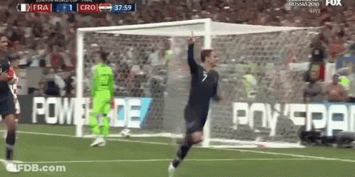 A Soccer Player Is Celebrating After Scoring A Goal During A Game GIF