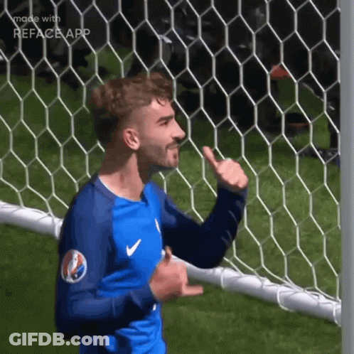 A Soccer Player Is Giving A Thumbs Up In Front Of A Net GIF
