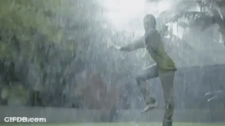 A Soccer Player Is Jumping In The Air In Front Of A Crowd GIF
