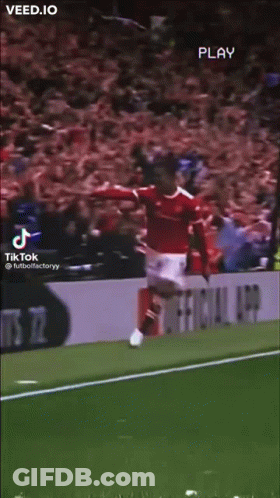 A Soccer Player Is Jumping In The Air On A Field . GIF