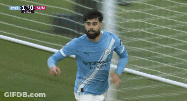 A Soccer Player Is Kicking A Ball During A Game Which Is Being Shown On A Television GIF