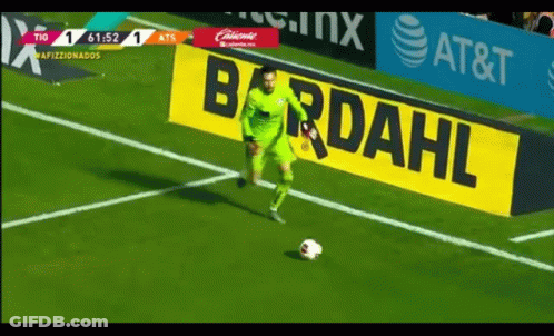 Soccer Player Kicking Ball In Front Of Bardahl Sign GIF